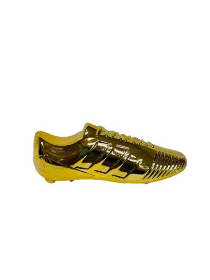 Zapato de futbol dorado